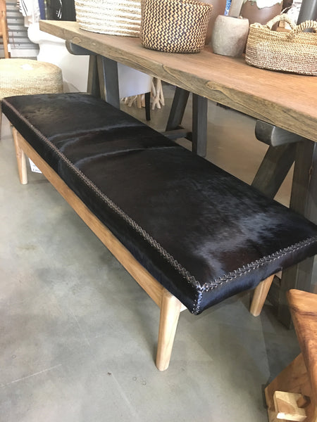 Black Cow Hide and Wooden Bench